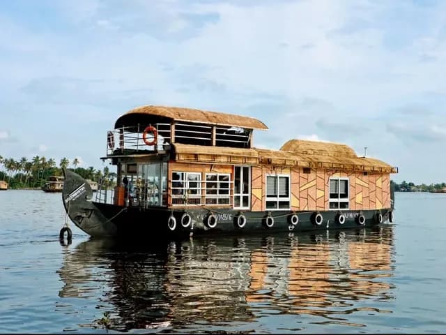 One of our Deluxe houseboats on the Alleppey backwaters